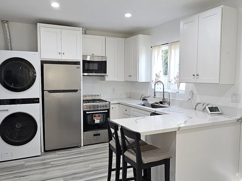 Different angle living room and kitchen area