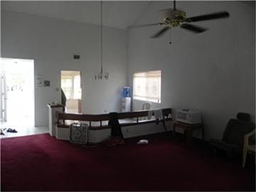 View of the Formal Dining room adjoined with Living/Den