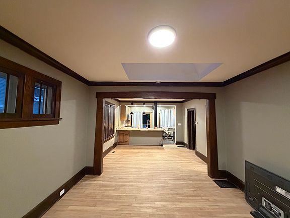 View from the front entry of the living room, dining room, and kitchen.