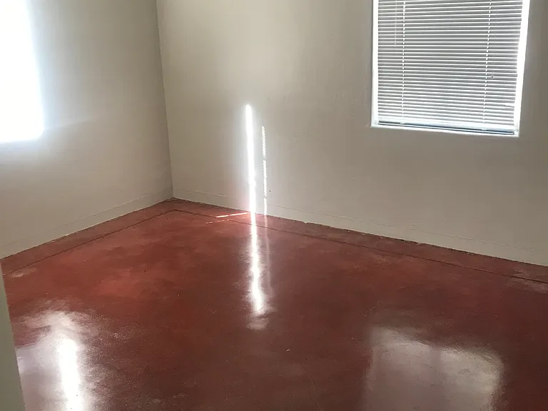 large back bedroom with large closet , ceiling fans and access to backyard