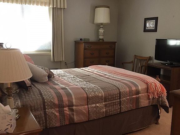 Master bedroom with newest comforter. Room set up as a suite by closing hallway door-has it's own full bath and numerous closets and linen cabinet.