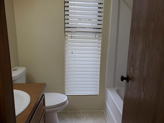 Upstairs full bath. Next to laundry area (not pictured).