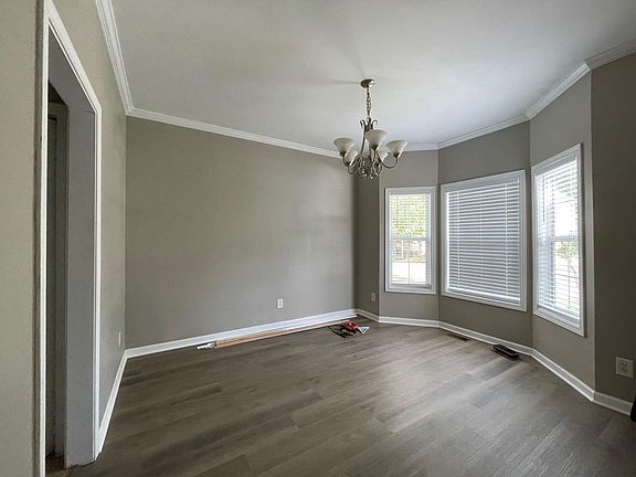 Family room. Windows face street.