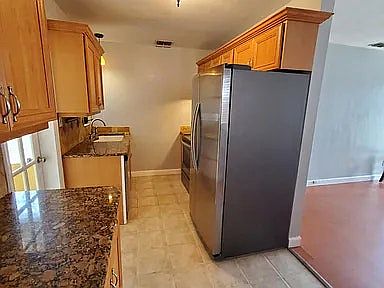 Granite counter top and double sink.