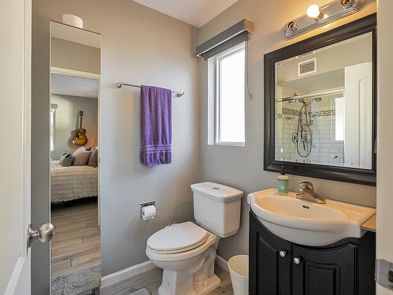 Primary bathroom featuring full-length mirror vanity and generous storage