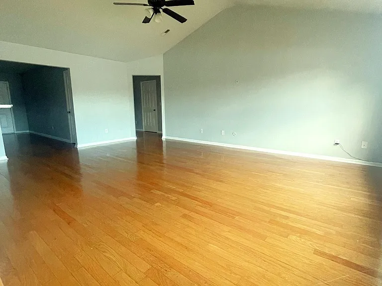 Living Room-Open floor plan with cathedral ceilings.