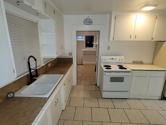 Kitchen area and opening to laundry area