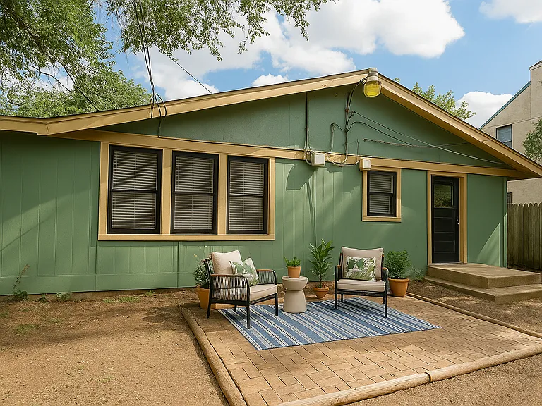 Large back yard with brick patio and storage shed. Yard is tree covered and privacy fenced.