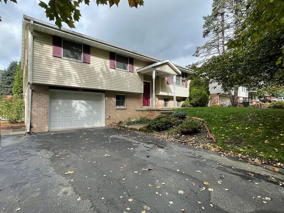 FRONT OF HOUSE WITH LARGE ONE CAR GARAGE