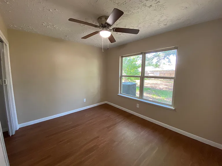 Third Secondary Bedroom with view of backyard