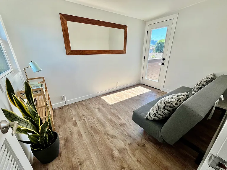 Office/extra room off bedroom opens onto balcony.