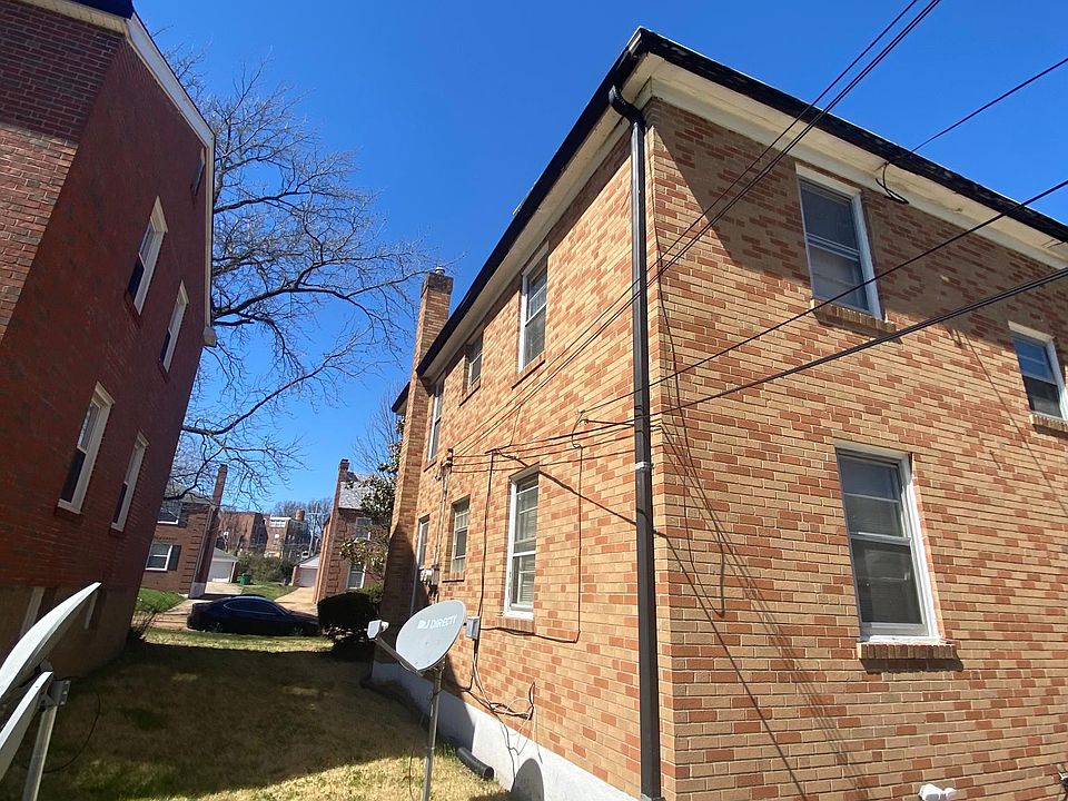 Back of building with entry into garage