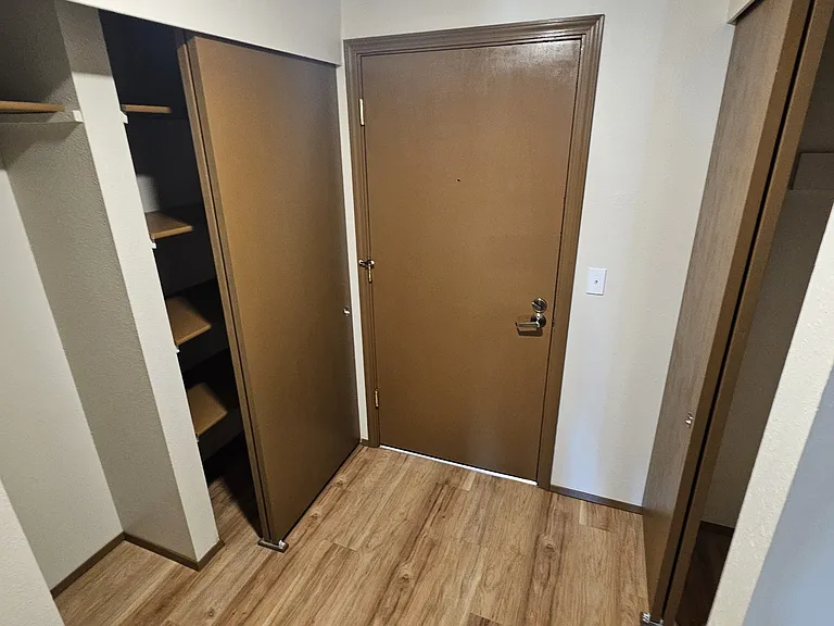 entry with open closets