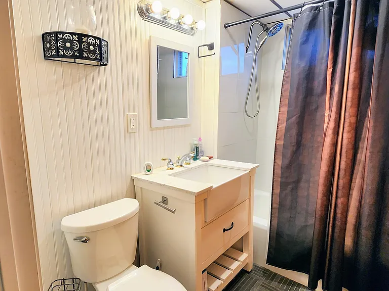 Shared Bathroom with Granite Floor Tile