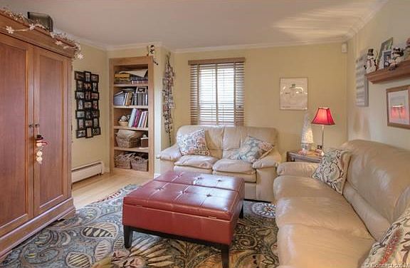 This sitting area off the kitchen is perfect for doing home work, reading or just relaxing while waiting for dinner.