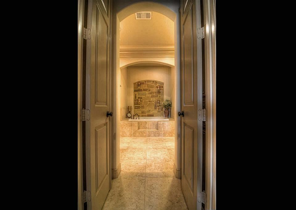 The picture of an exclusive spa perhaps? Actually, His and Her Closets front the double doors that l