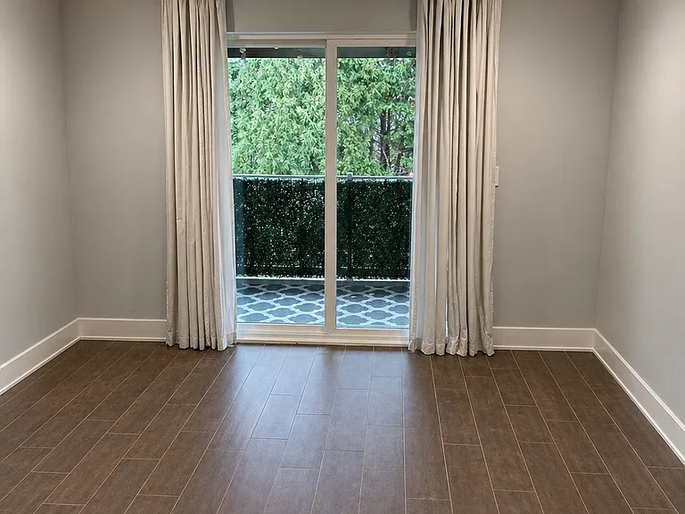 Primary room with built in closet and bathroom, balcony access
