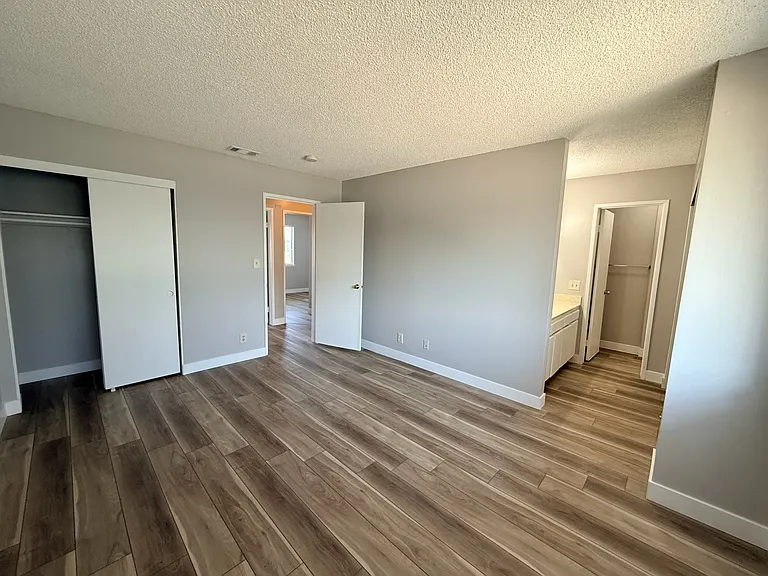 Large, bright master bedroom with full bathroom.