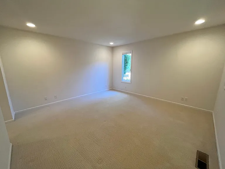 Bedroom #2 has a walk-in closet and comfortable plush carpeting.