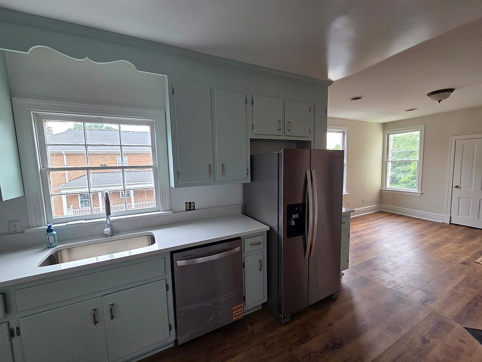 Newly renovated kitchen with view into living room