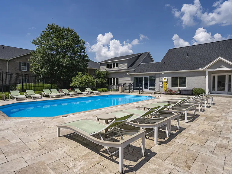 Dive into relaxation at our community pool, surrounded by comfortable lounge chairs and inviting spaces to unwind.