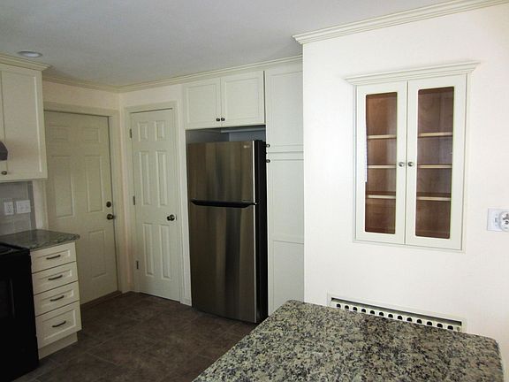 kitchen view with entry to garage and utility closet