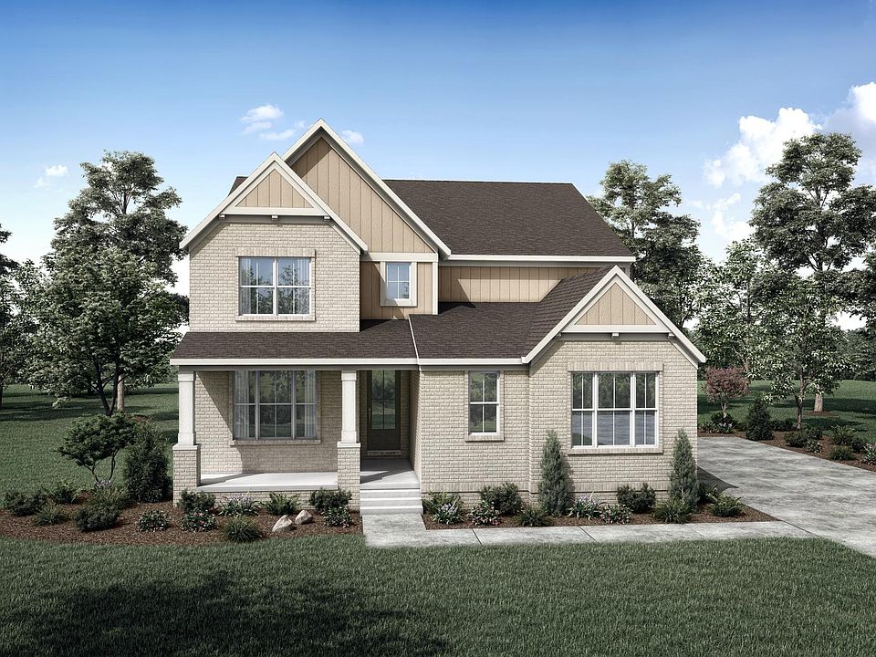 two-story home with board and batten, and brick