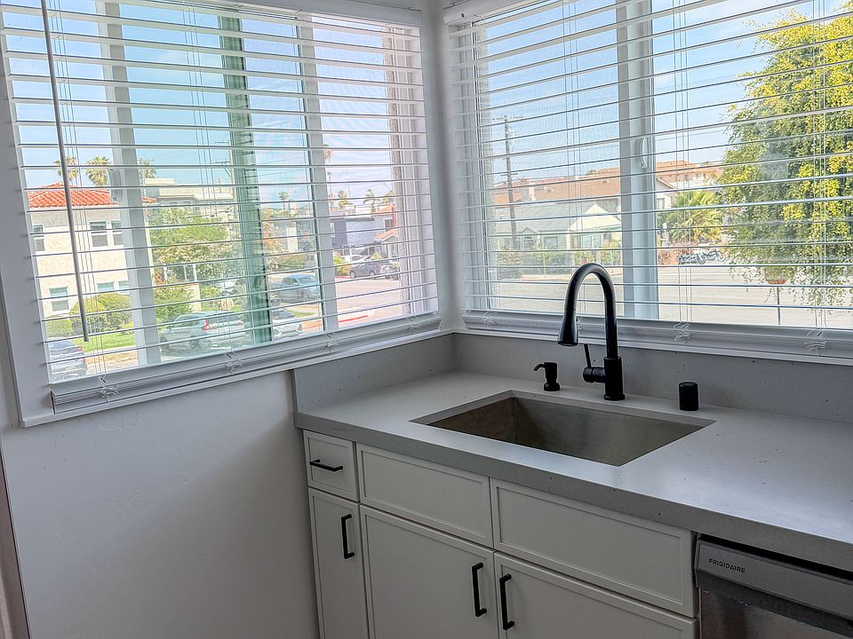 Whether you're washing dishes or prepping dinner, the abundant natural light and stunning backdrop turn this functional space into a peaceful retreat, making time spent in the heart of the home feel entirely effortless.