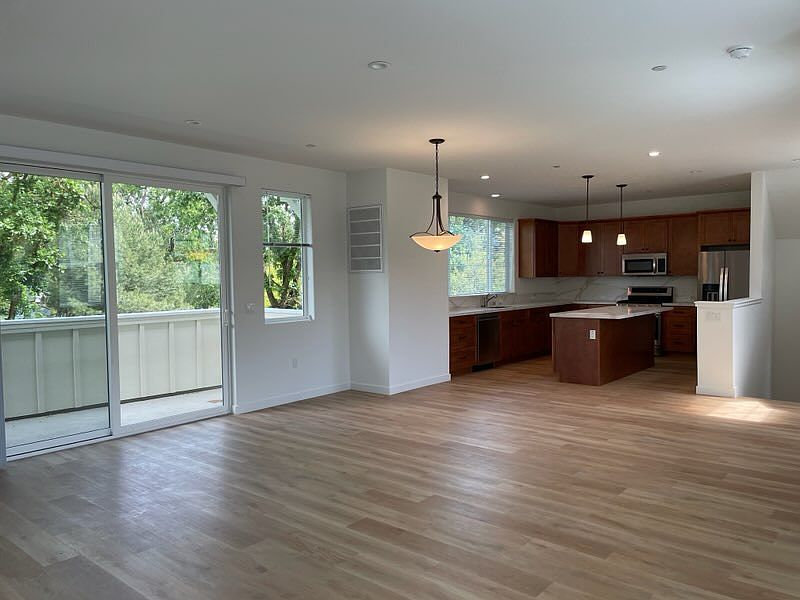 Huge kitchen/dining/living room space, truly open concept with so many windows