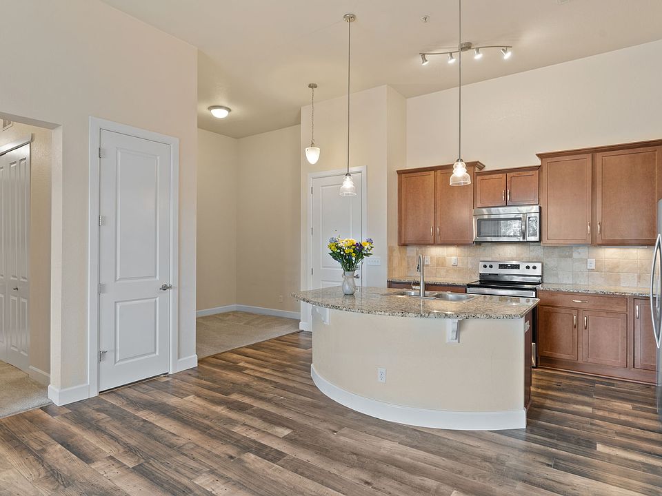 Kitchen With Large Island and Den Area