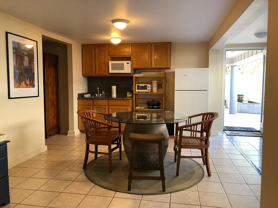 The dining and kitchen area, and front entry.