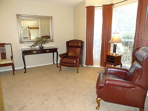 Located at the front of the home, directly off the entry is the formal living room (13x12).  It has a bay window overlooking the front yard.  Carpet throughout the home was replaced in 2010.