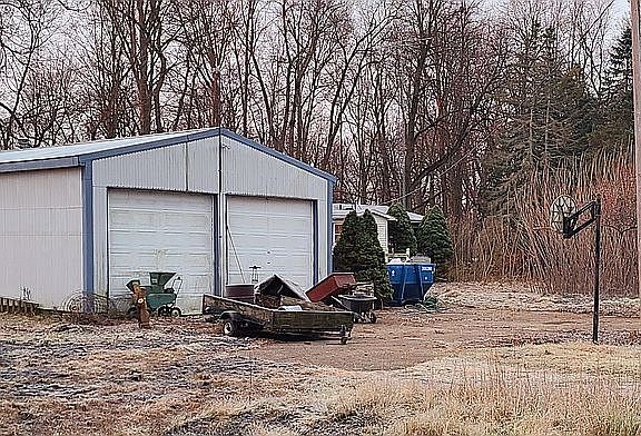 Cleanup in process by barn
