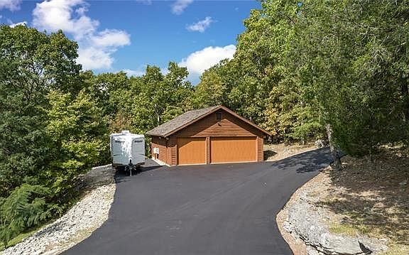 TRUE 5 car garage: 2 attached, 3 detached.