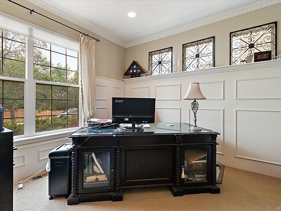 Bright Den/Study with formal paneling and double glass door entry
