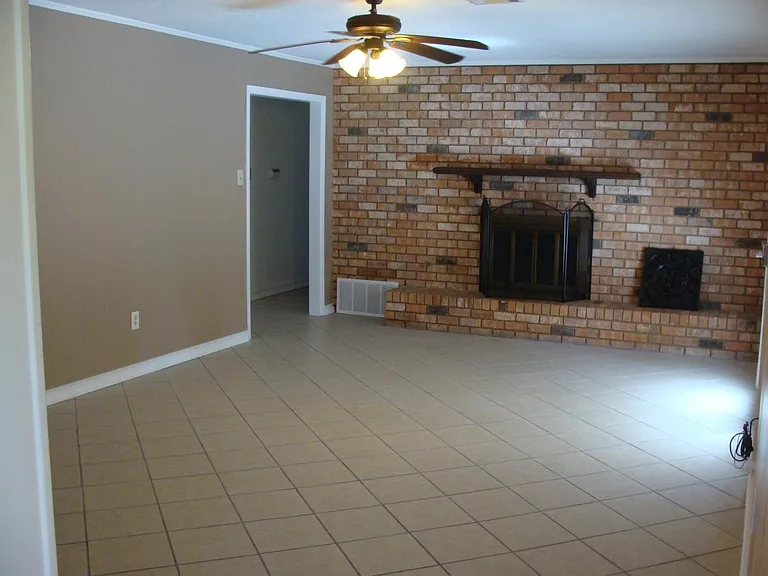 Den with Wood-Burning FirePlace, Brick Hearth & mantel