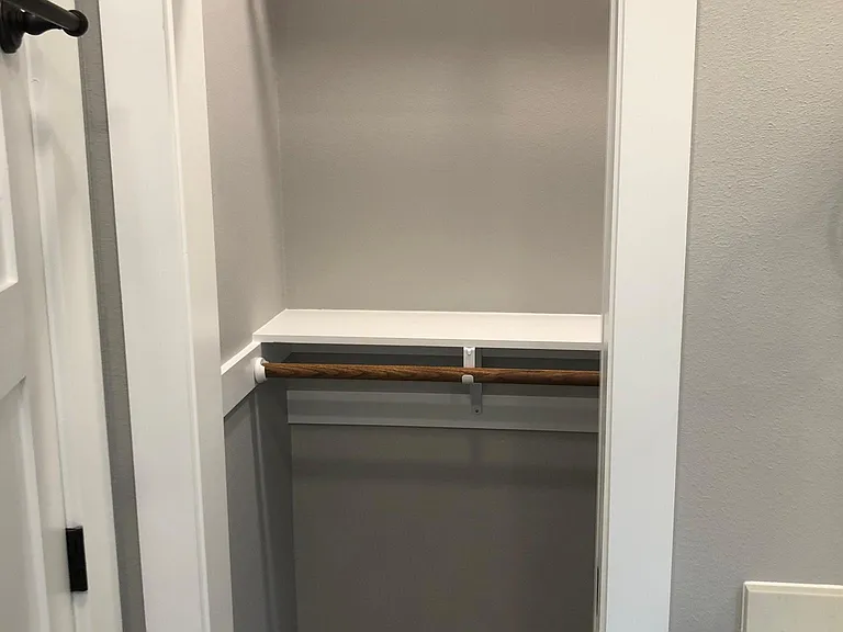 5' long walk in closet with pocket door