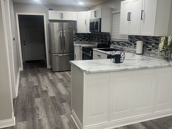 kitchen & hallway to back door and laundry room