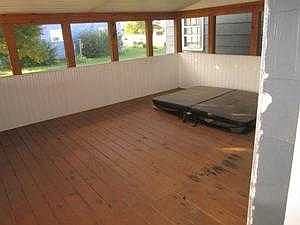 enclosed porch with jacuzzi