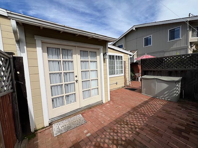 Front entrance to studio, enclosed patio. Storage bin is for tenant's use