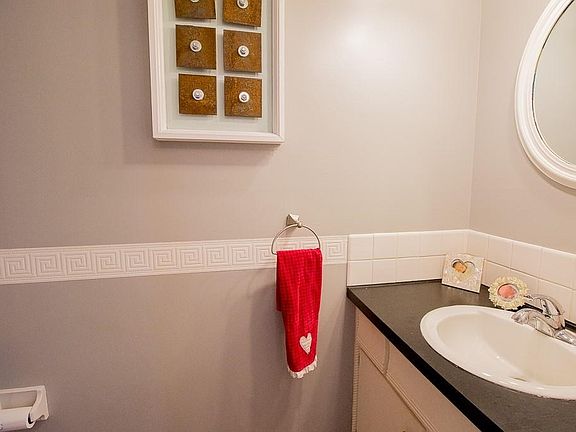 First floor half bathroom located off first floor foyer.