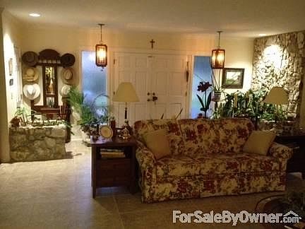 Entry to Open Living Room
						:
						Large natural stone planters and wall accent Entry Way