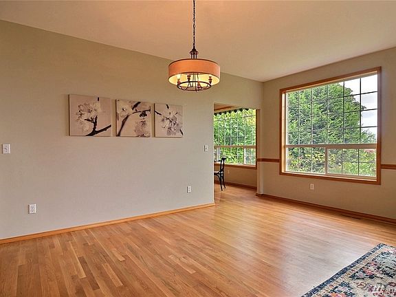Dining room off Kitchen and Living Roon with large windows to tak in the view.