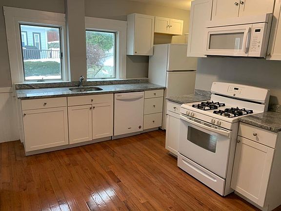 Kitchen includes granite counter tops and new cabinets.