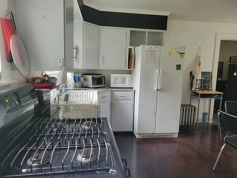 BIG Eat in Kitchen. Sunny. New Sept '24 gas stove. Windows. Washer and Dryer. French Fridge. Granite counters. 1920 Barn Find Farm Sink.. Dark Hardwoods. Leads to covered patio overlooks big grassy back yard with mature trees. Fenced patio-small yard.