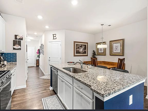 Kitchen with island and Smart Things appliances