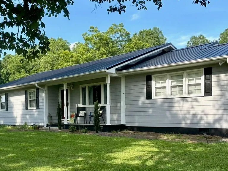 Front exterior of the home with sitting porch.