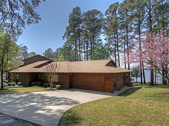 Paved driveway leads to two car garage.