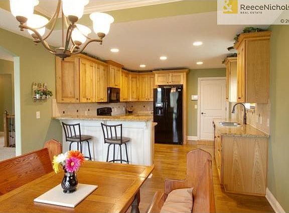 Kitchen w/ Beautiful Wood Cabinets, Granite Counters, and a Brea