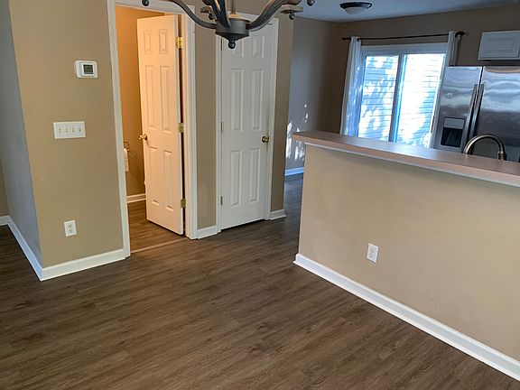 Powder room next to kitchen pantry near the eat-in Kitchen
